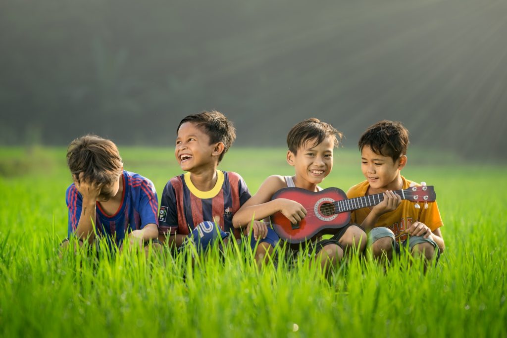 Children laughing in the rice fields together