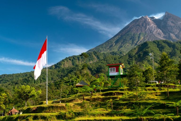 Indonesian flag in front of a mountain -Destinations in Indonesia