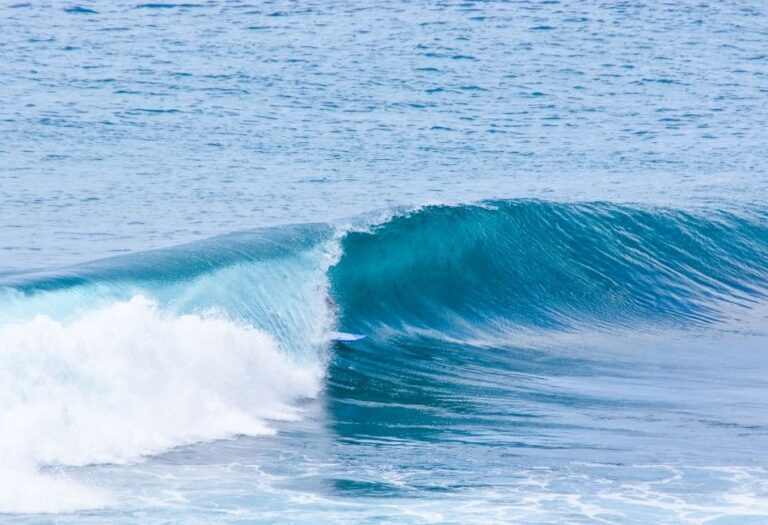 Surfing on Uluwatu Beach in Bali